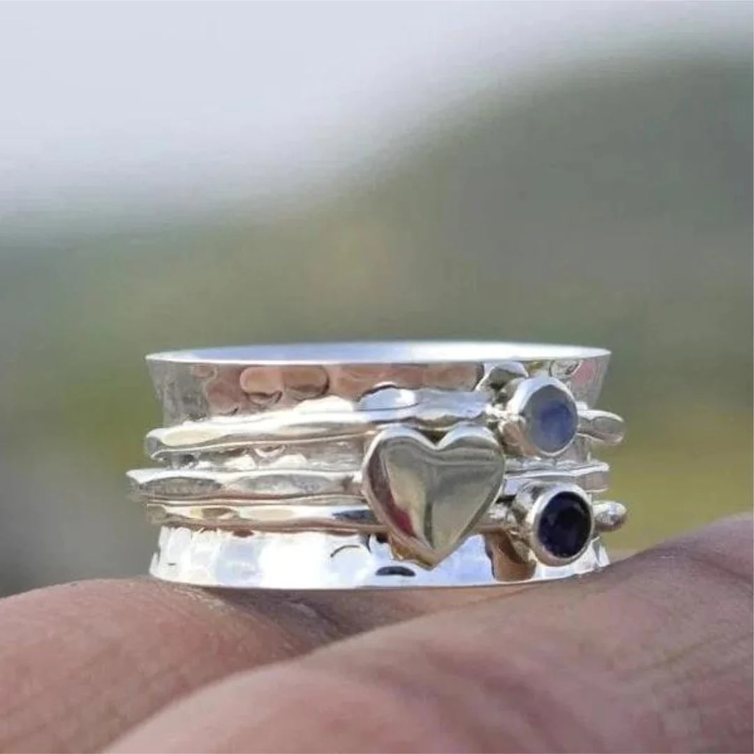 Elegant rotating heart sterling silver ring